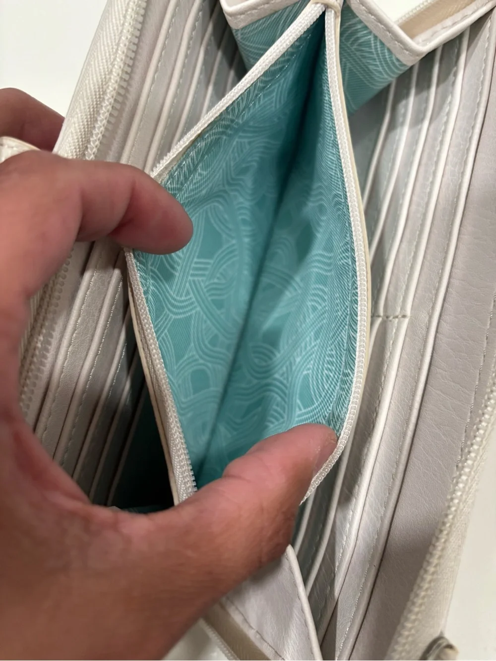 The Sak Light Cream Wristlet Clutch